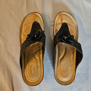 Atalina black wedge slip-on sandals.